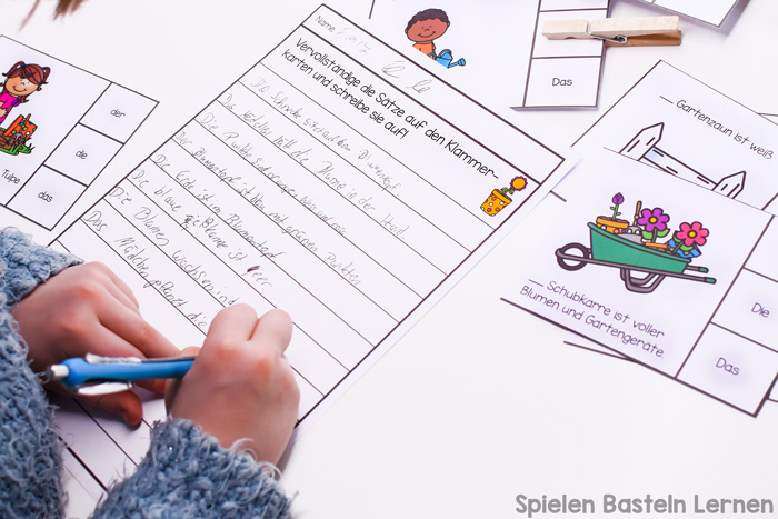 Grundschüler können Begleiter üben mit diesen niedlichen Artikelklammerkarten zur Gartenarbeit. Mit Anleitungskarten und passendem Blatt zum Schreiben der Sätze.